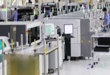 Ericsson automated smart factory operational in China Ericsson Nanjng factory - engineers on factory floor