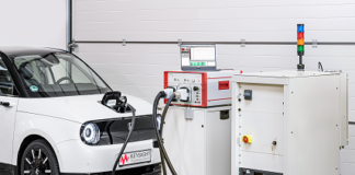 Keysight's SL1202A Scienlab Regenerative AC Emulator (right) with SL1040A Scienlab Charging Discovery System (middle) testing an EV's onboard charger (left)