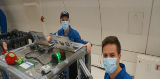 Working on the printer during the flight (Source: ESA)