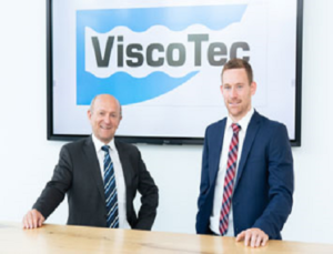With a change in top management, ViscoTec is writing a new chapter in its highly successful company history. The long-standing Commercial Managing Director, Georg Senftl, will retire at the end of 2021. He will be succeeded on 1st July by 32-year-old Franz Kamhuber, who is currently responsible for global sales as Sales Director. Change in Management at ViscoTec: Georg Senftl (left) and Franz Kamhuber (right) Georg Senftl (left) and Franz Kamhuber (right) For the next six months, Franz Kamhuber and Georg Senftl will jointly steer the company’s affairs together with Martin Stadler, the Technical Managing Director. “I am confident that with Georg Senftl as my sparring partner, I will be able to completely carry out my role in management after a few weeks,” Franz Kamhuber emphasizes. For over six years, Franz, who is a degreed industrial engineer, has had a strong mentor in Georg Senftl. Asked about his goals, he mainly refers to his predecessor’s successes: “The bar is high, and I am aware of the large footprints I am stepping in. I will continue along this successful path.” ViscoTec has continuously grown in the past, and Franz Kamhuber already sees the potential for the future very clearly. In the long term, the company plans to open more subsidiaries worldwide in order to expand internationally. The recently established subsidiary in France is just one example of what this growth can look like. Further subsidiaries are being planned, as Franz Kamhuber explains: “The change in the world markets and the shift of production facilities for electronics manufacturing towards Asia, not only opens up growth potential, but also demands a corporate rethink.” If the East Asian market around China, Korea, Japan, etc. continues to develop so rapidly, companies will manufacture electronic components there for almost all industries in the future. “These are opportunities to present our dispensing technologies to the global markets.” In the long run, Franz Kamhuber can imagine establishing further subsidiaries, perhaps even individual production stages, in East Asia. “None of this is something that will be implemented overnight, but as a company we have to start to take a close look at the value chains of the future in order to make use of opportunities,” explains the Bavarian native. ViscoTec is currently experiencing an unprecedented boom in orders. A new production hall including office space is planned on the company premises in Töging to be able to handle all orders. Franz Kamhuber knows his responsibility: “I know every face in the company because of my long history. I want to offer my colleagues the best working conditions, even with a high volume of orders. Then it’s a matter of looking at where automated processes can take effect in order to become even more efficient.” He is looking forward to his new role, says Franz Kamhuber, who is married and has two children. “The little ones are just 3- and 1 year old. Besides my career, it is important to me, to be able to spend time with my wife and see the children grow up.” This is entirely in line with Georg Senftl’s approach, who has always based ViscoTec’s success on the strong – almost family-like – cohesion of all employees.